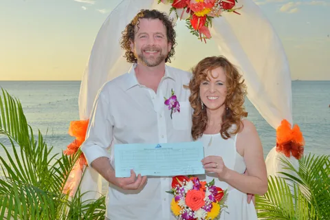 Couple with their wedding certificate